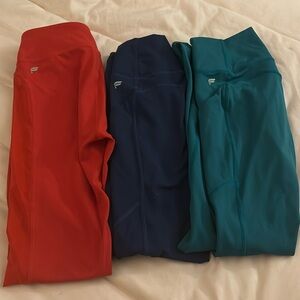 three pairs of fabletics leggings size XS